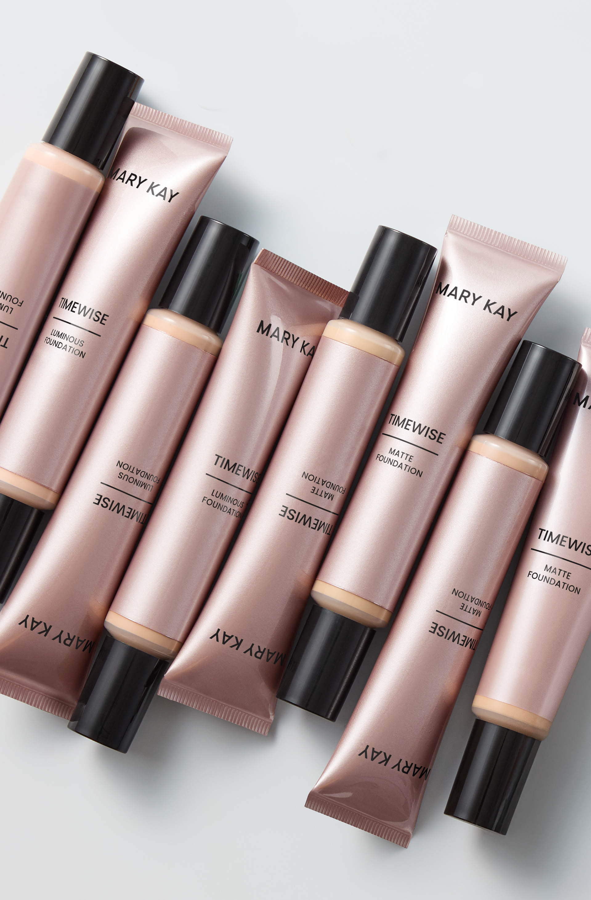  Tubes of Mary Kay TimeWise 3D Foundation in sleek rose‑gold packaging standing upright at various angle 